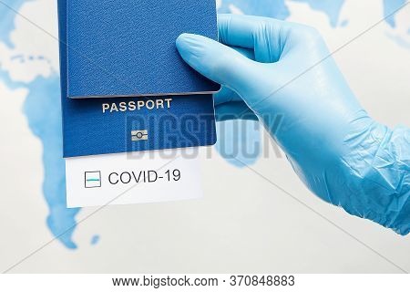 Immunity Passport, Risk-free Certificate Concept. Hand In Medical Gloves Holds Passports With Note C