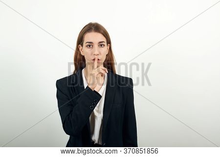 Index Finger On Lips, Silence Gesture, Shhh Quiet, Asks For Voicelessness Forefinger At The Mouth. Y