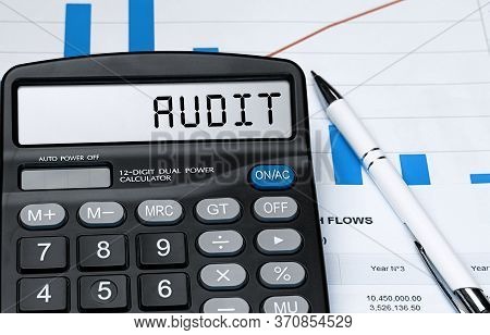 Word Audit On Calculator. Business And Tax Concept. Stock Photo