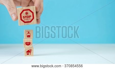 Manual Organization Wood Block Stacking With Health Icon Coronavirus. Insurance For Your Health Conc