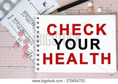 Notebook Page With Text Check Your Health On A Table With A Pills And Pencil, Medical Concept, Top V