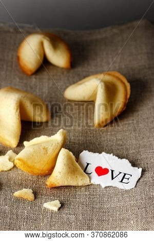 Cookies Shaped Like Tortellini With The Word Love Written On A Paper.vertical Image.