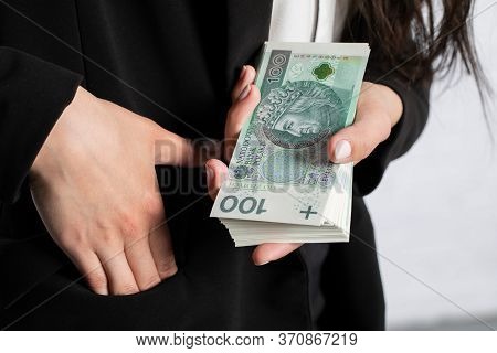 Close-up Shot Of Banknotes And A Womans Hand.