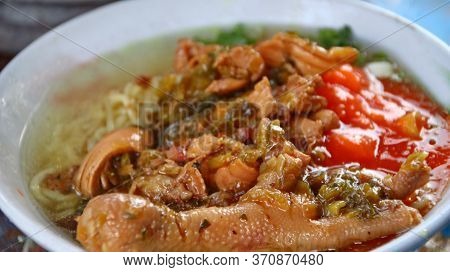 Indonesian Food, Mie Ayam, Noodles With Chicken Presented Directly By The Seller On The Cart, Unfocu