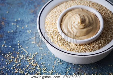 bowl full of tahini sauce - food and drink