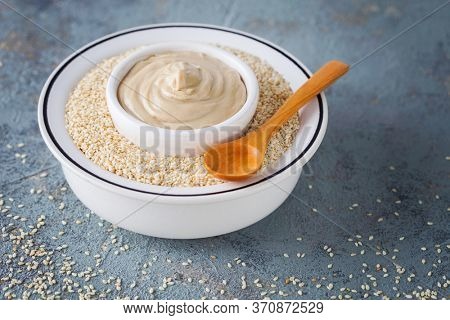 bowl full of tahini sauce - food and drink