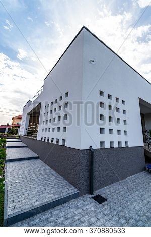 Shot Of A White Concrete Wall. Hi Tech House. View From The Angle. Modern Building.