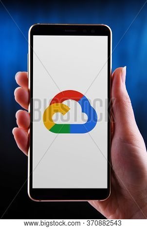 Poznan, Pol - May 21, 2020: Hand Holding Smartphone Displaying Logo Of Google Cloud Platform (gcp), 