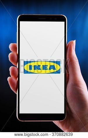 Poznan, Pol - May 21, 2020: Hands Holding Smartphone Displaying Logo Of Ikea A  Multinational Group 