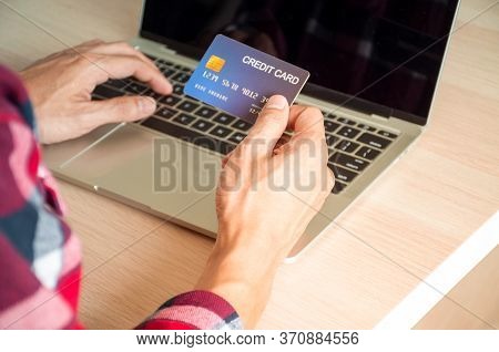 Online Payment Concept, The Hands Of Young Men Using Credit Cards And Using Computers For Online Sho