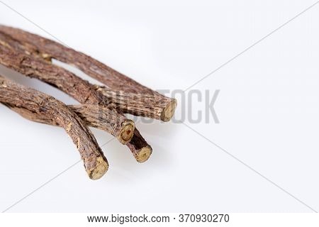 Close Up Of Ayurvedic Herb Liquorice Root,licorice Root, Mulethi Or Glycyrrhiza Glabra Root On A Woo