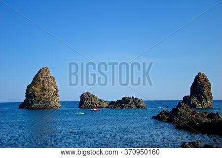 Rocky Shores Near Catania, Sicily Captured On A Clear Summer Day