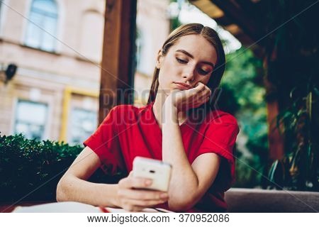 Dispirited Female Blogger Reading Repetitious News Spending Recreation Time On Social Networks