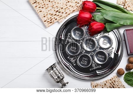 Flat Lay Composition With Passover Seder Plate (keara) On White Wooden Table. Pesah Celebration