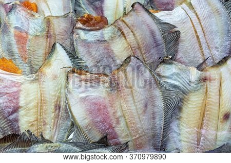 Lot Of Salted Dried Fish Ocean Plaice. Background Of Group Flatfish With Caviar. Stock Fish Asian De