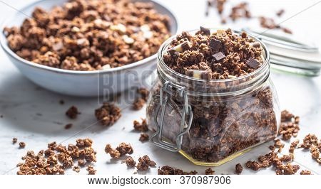 Jar Of Muesli With Dark And Milk Cocolate Pieces - Closeup.