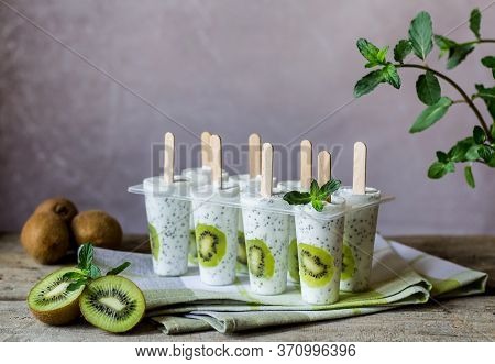 Homemade Ice Cream Pops Made With Kiwi, Chia Seeds And Yogurt, Decorated  With Fresh Mint. Summer Re