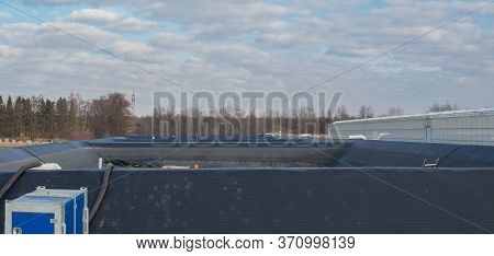 Irrigation Basin For A Greenhouse For Growing Tomatoes And Peppers