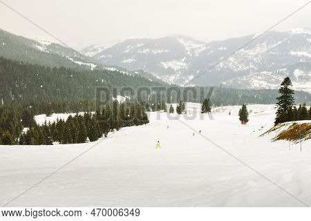 Beautiful Snowy Goderdzi Ski Resort Panorama With Skiers On Slopes. Georgia Caucasus Mountain Holida