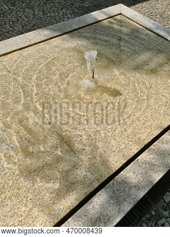 A Crystal Clear Fountain With Refreshing Water On A Scorching Summer Day.