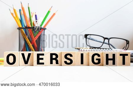 Text Oversight On Wooden Block. Concept Business