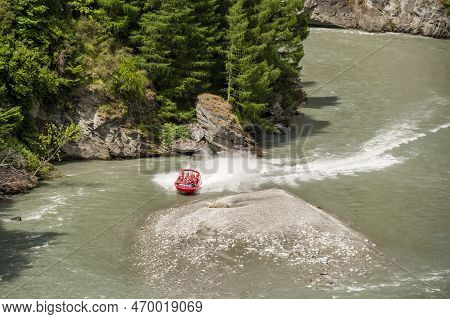 Shotover River, Queenstown, New Zealand - 20th December 2022: A Shotover Jetboat Full Of Passengers 