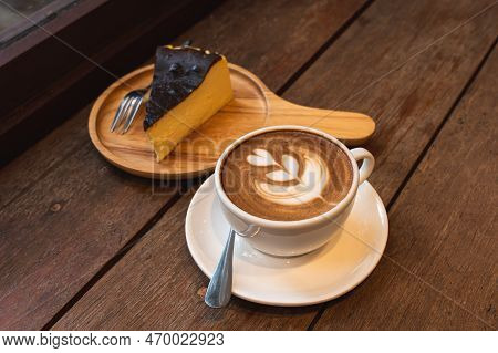 Hot Coffee Latte With Latte Art Milk Foam In Cup Mug And Homemade Chocolate Cake Wood Desk On Wood D