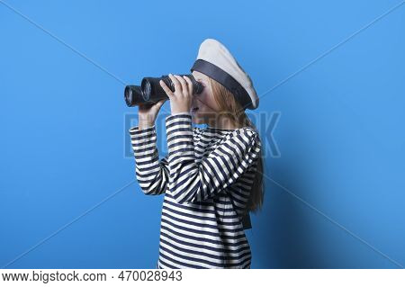 A Teenage Girl In A Sailor Suit With A Binocular Looking Into The Distance, Horizontal Portrait Of A
