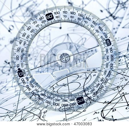 Protractor on the background of mathematical formulas and algorithms