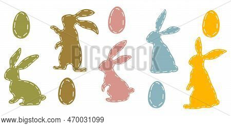 A Set Of Colored Easter Bunnies And Colored Easter Eggs. The Contours Of Rabbits And Eggs Are Stitch