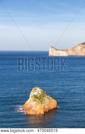 Rocky Cliffs On The Sea Coast. Sardinia, Italy. Nature Background