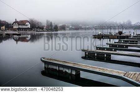 Boat Jetties On A Foggy Winter Day At Reifnitz Am Worthersee On The South Shore Of Worthersee, Or Wo