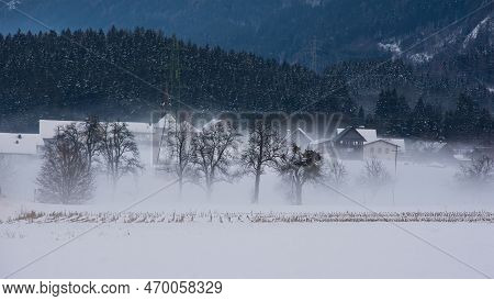The Foggy And Snowy Winter Landscape Near Pockau In Arnoldstein, Carinthia, Austria