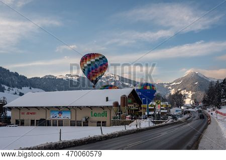 Chateau-d'oex,vaud, Switzerland - 23 January 2023: Hot Air Balloon Flying In The Sky. Hot Air Balloo