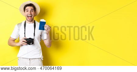 Travelling, Vacation And Tourism Concept. Excoted Tpirost Showing Passport With Tickets, Holding Cam