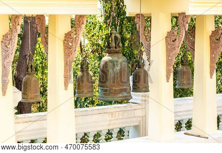 Buddhist Temple Bells. Bells In A Buddhist Temple Of Thailand. Row Of Large Bells