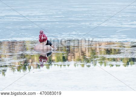 Man Or Boy With A Warm Hat And Gloves Ice Bathing In The Cold Water Of A Lake. Wim Hof Method, Cold 