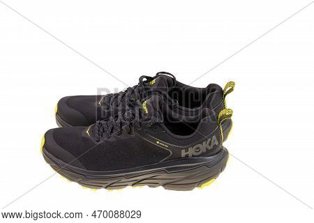 Close Up View Of Black Yellow Hoka Sneakers Isolated On White Background. Sweden. Uppsala. 02.05.202