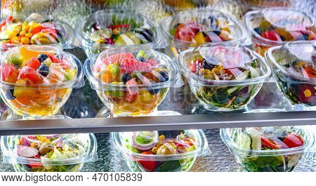 Boxes With Fruit And Vegetable Salads In A Commercial Fridge
