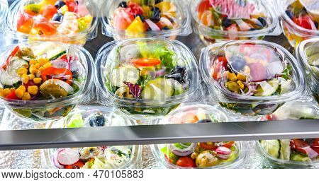 Boxes With Fruit And Vegetable Salads In A Commercial Fridge