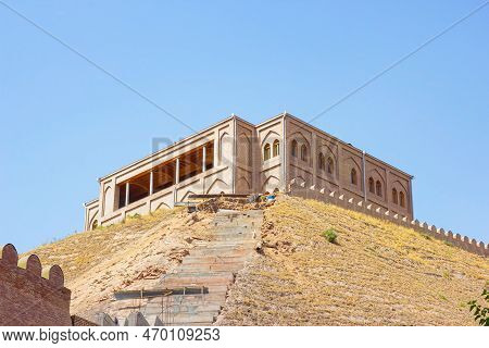 Hisor, Tajikistan - July 31, 2022: Ancient Hisor Fort In Summer Against The Blue Sky.