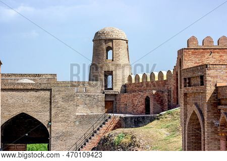 Hisor, Tajikistan - July 31, 2022: Ancient Hisor Fort In Summer Against The Blue Sky.