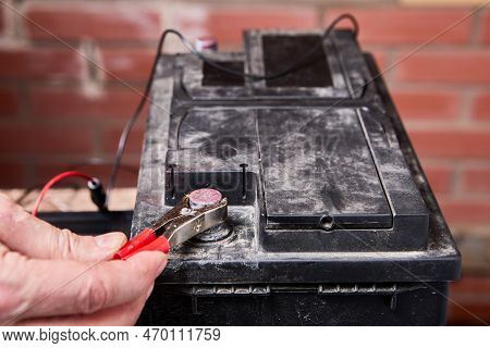 Car Battery Charger Is Used To Charge Akkumulator Removed From Auto.