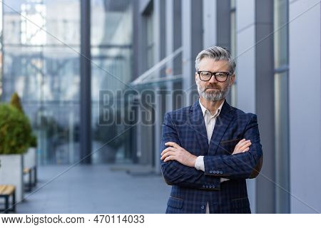 Portrait Of Mature Successful Boss, Gray Haired Businessman Looking At Camera With Crossed Arms, Man