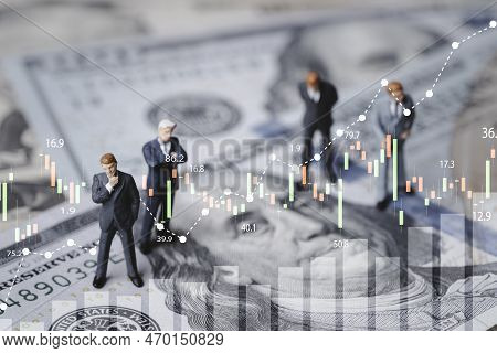 Businessmen Miniature Figure Standing On Usd Banknote With Stock Market Chart Graph For Currency Exc