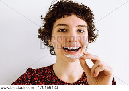 Teenage Girl Wears An Orthodontic Silicone Trainer. Invisible Curly Brackets Aligner. Mobile Orthodo