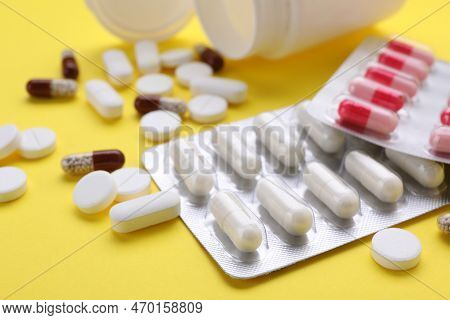 Different Antidepressants On Yellow Background, Closeup View