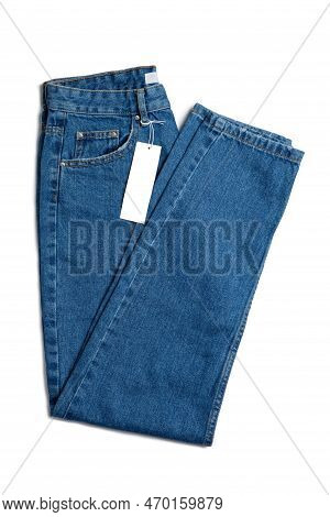 Blue Jeans Pants And Price Tag Isolated On White Background. Denim Background, Texture, Mockup. Fash