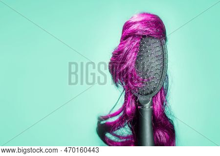 Hair Coloring And Dye. Comb With Pink Wig On Turquoise Background, Similar To Woman's Head. Copy Spa