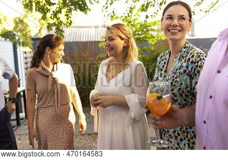 Happy Female Friends Spending Time Together, Young Woman Drinking Aperol Spritz Cocktail On Outdoors